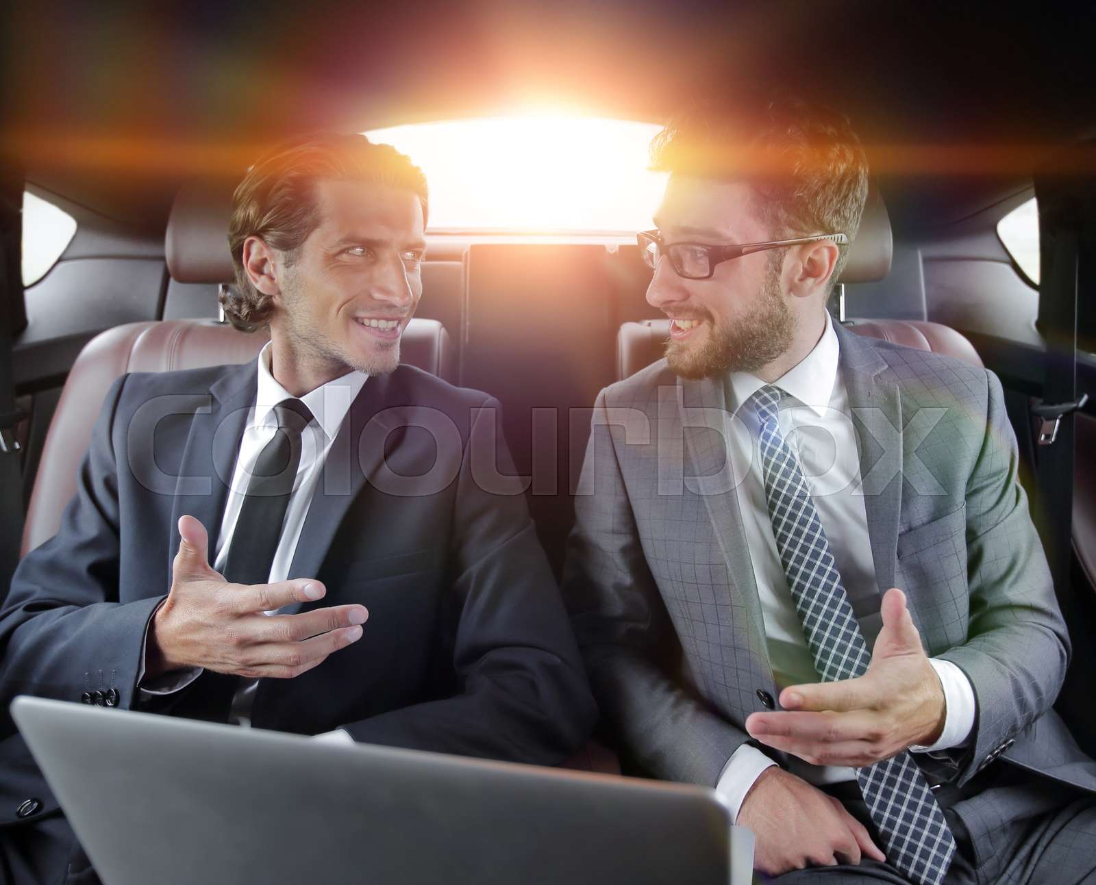 Talking In A Car two businessman talking while sitting in the car | Stock image | Colourbox