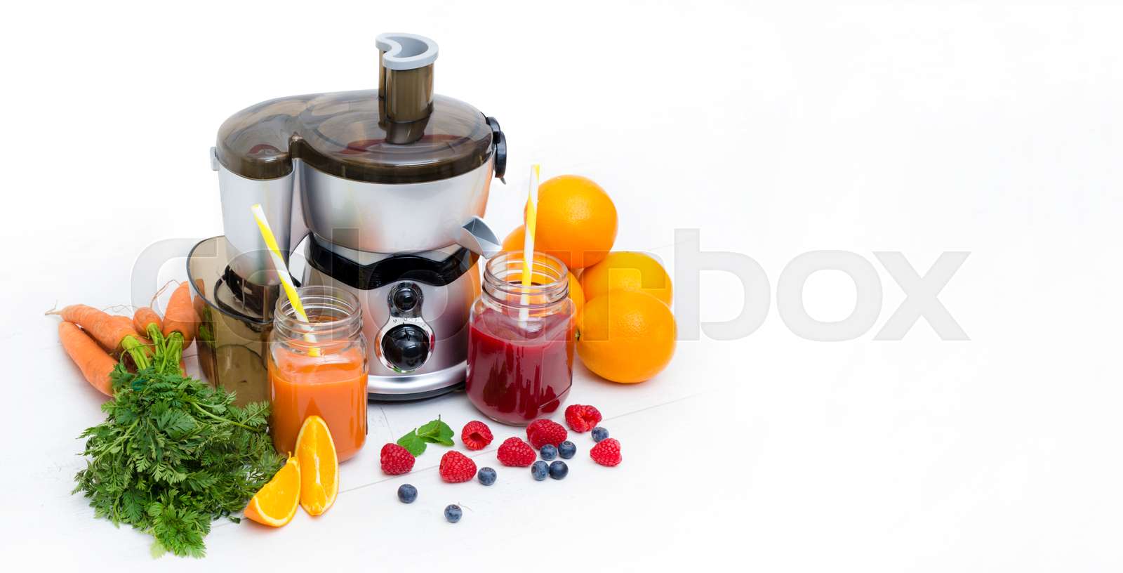 Preparing juice from fresh fruits and vegetables Stock image Colourbox