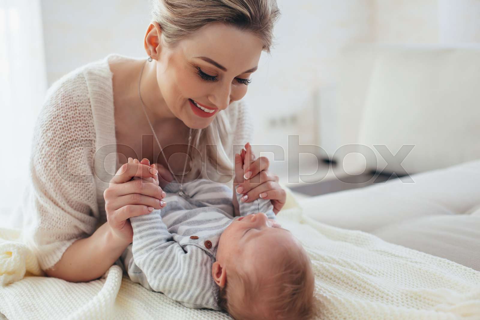 2 month old baby with mom Stock image Colourbox