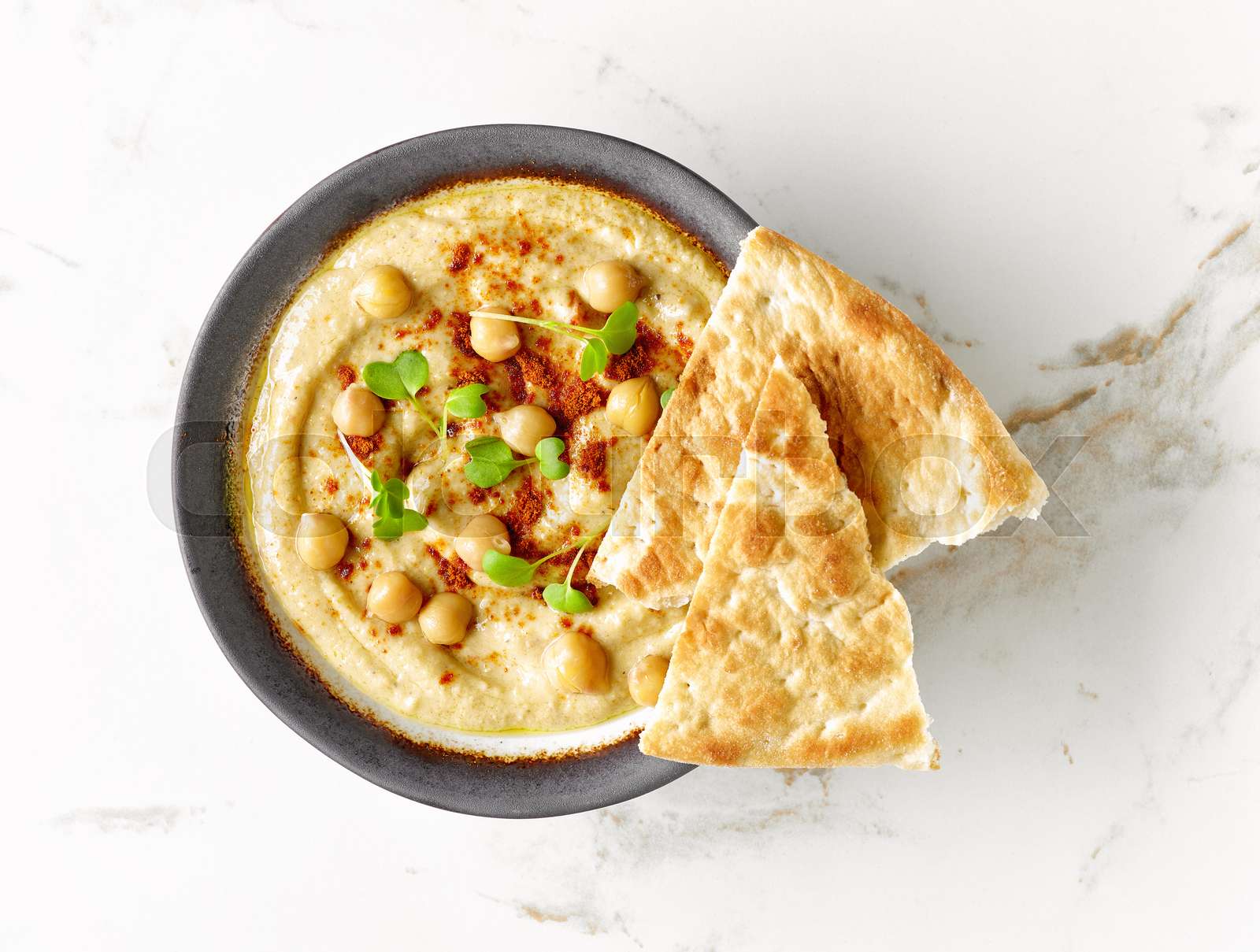 bowl of hummus Stock image Colourbox