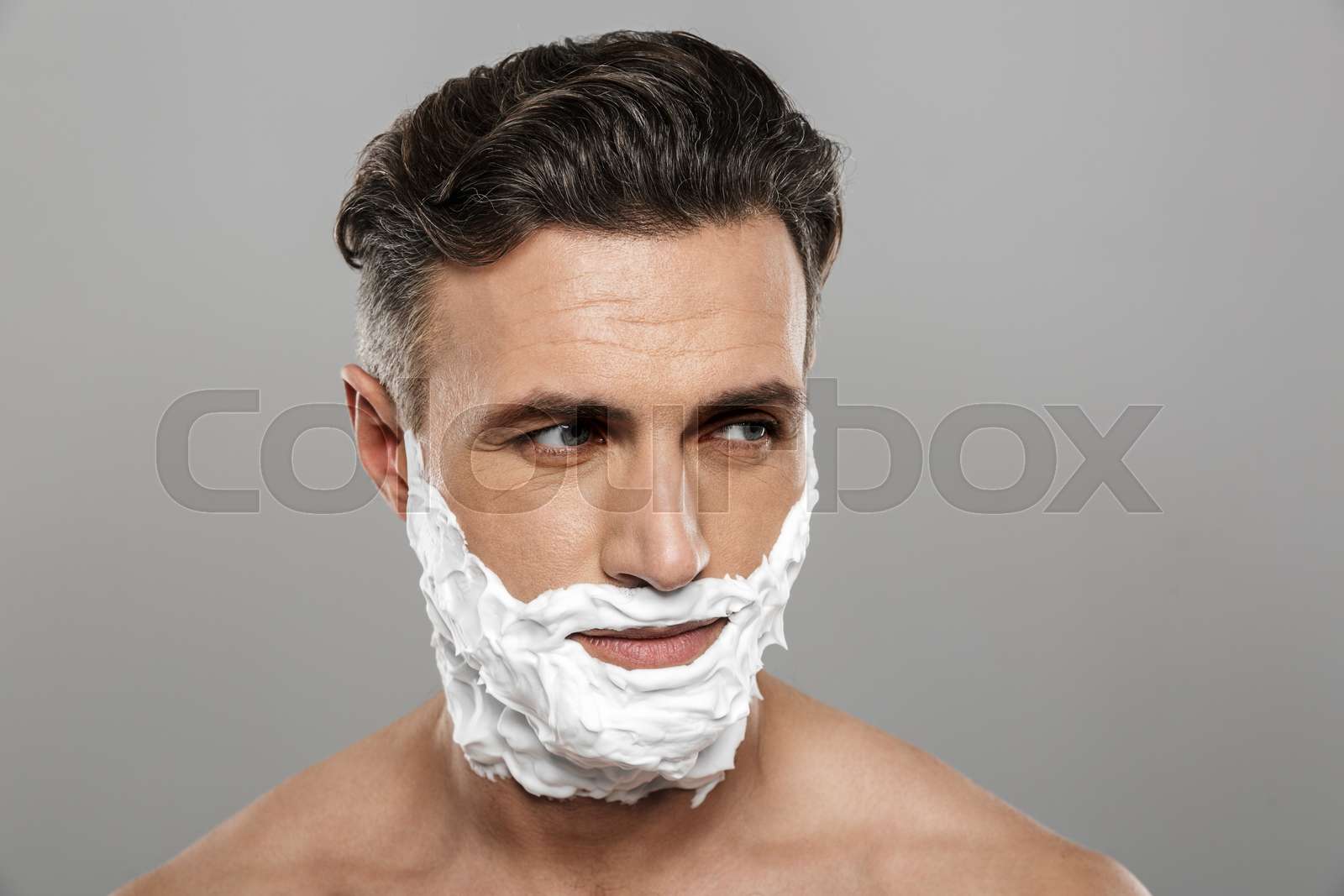 Mature Man Standing Isolated With Shaving Cream On Face Stock Image 