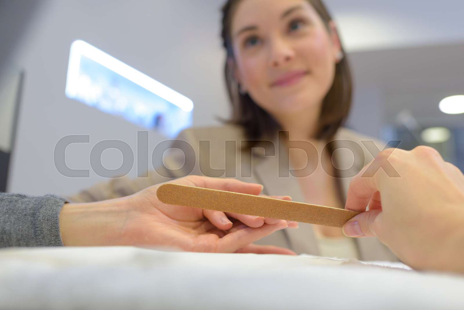 Manicurist Doing A Nail Filing At A Salon Stock Image Colourbox
