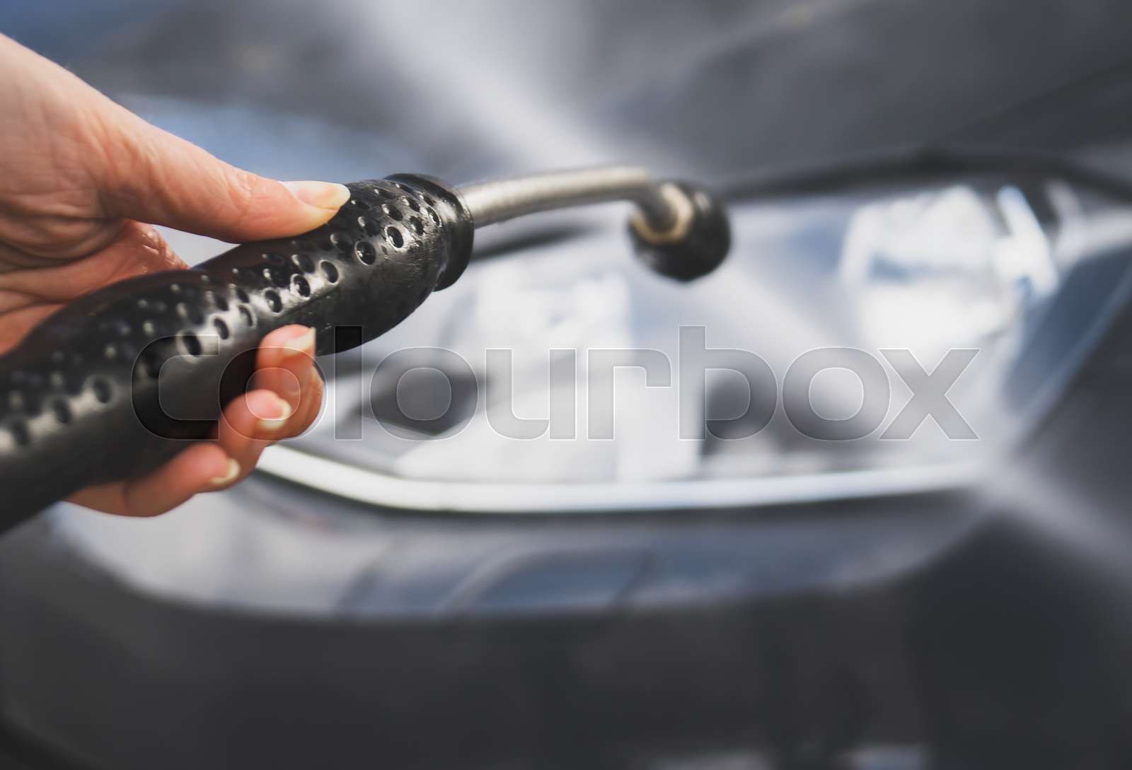 Car wash using high pressure water jet. | Stock image | Colourbox