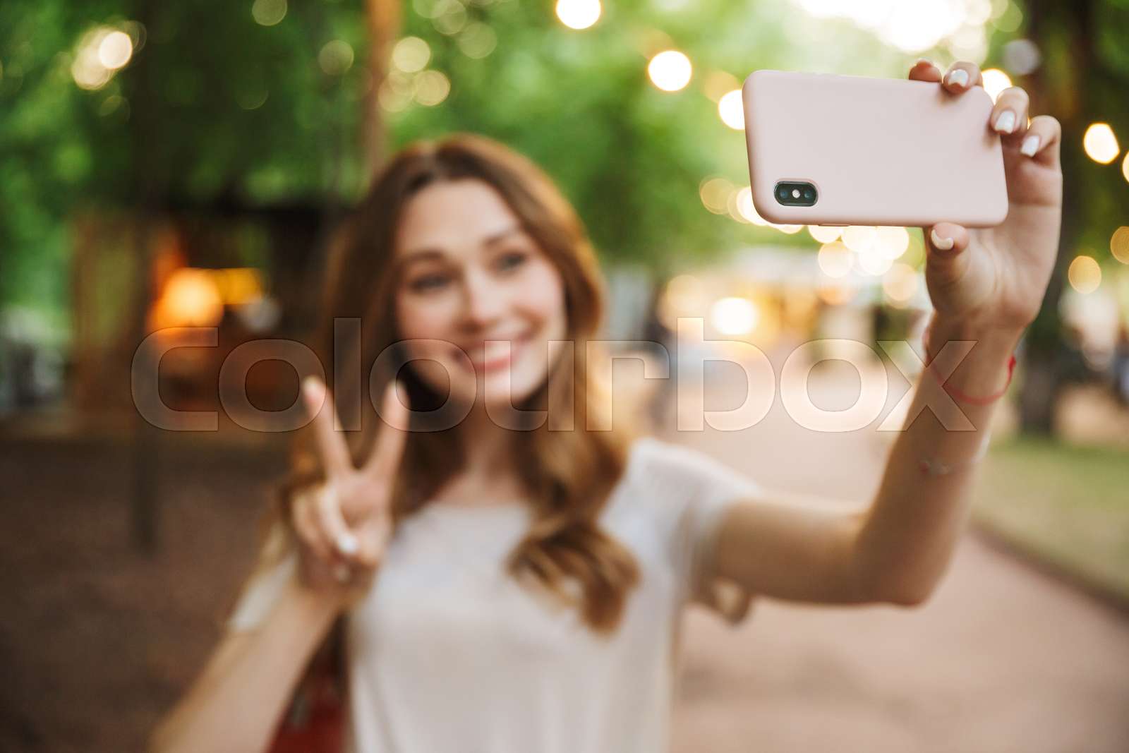 Happy young girl taking a selfie | Stock image | Colourbox