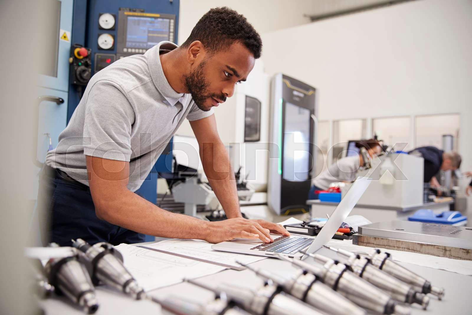 Male Engineer Using CAD Programming Software On Laptop | Stock image ...