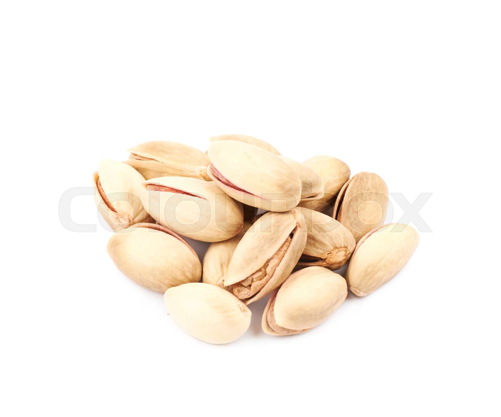 Pile of pistachios isolated Stock image Colourbox