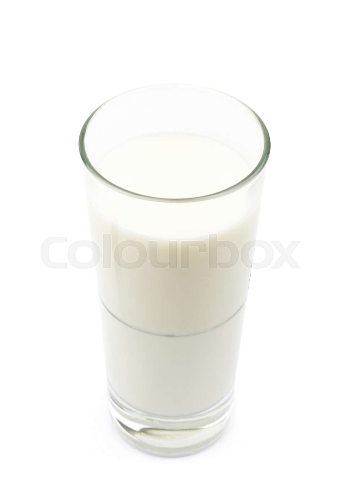 Tall glass of milk isolated Stock image Colourbox