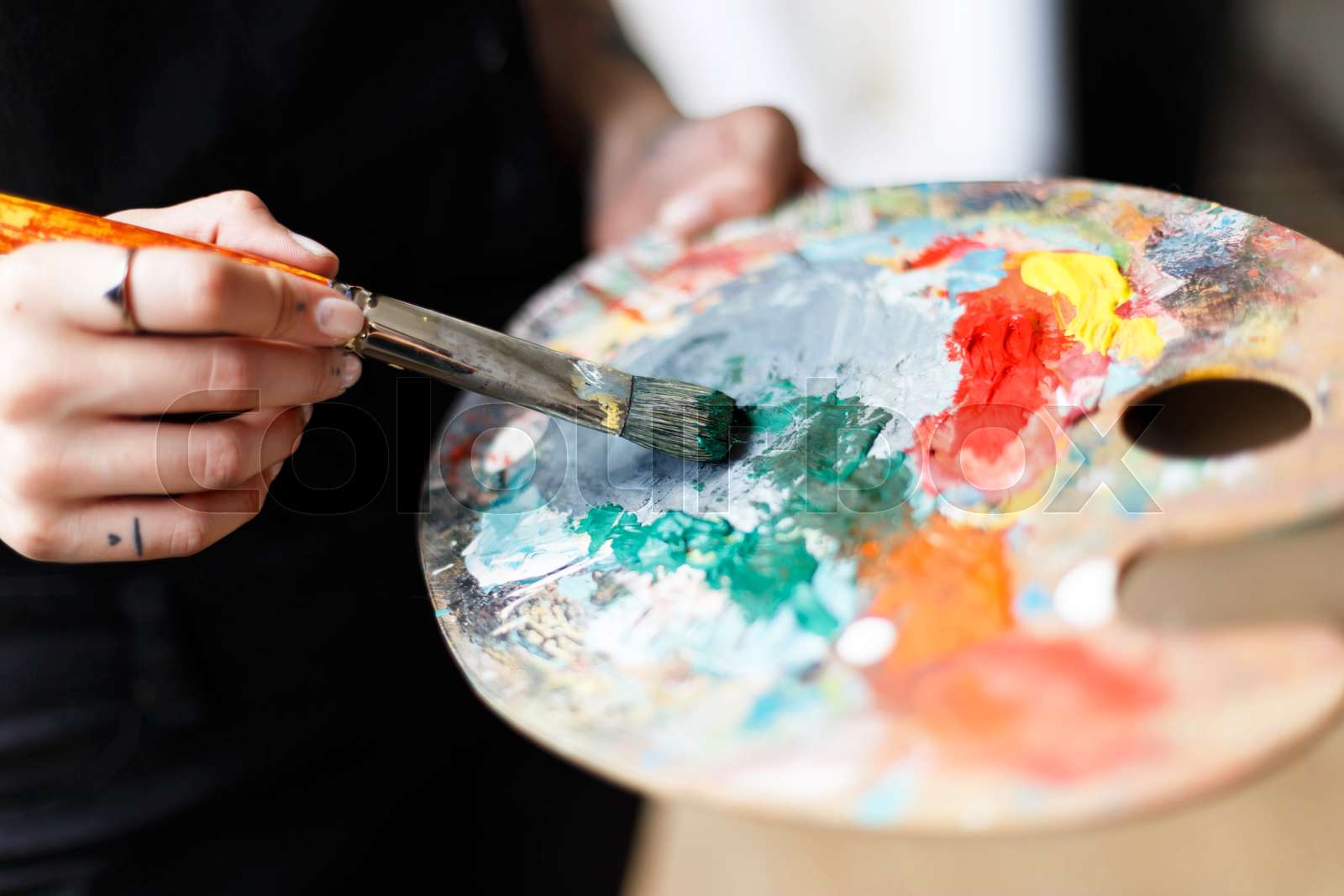 Beautiful Artist Holding Brush and Palette Stock image Colourbox