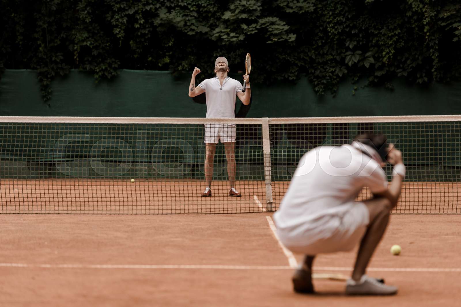 retro styled tennis player showing yes gesture after winning game at