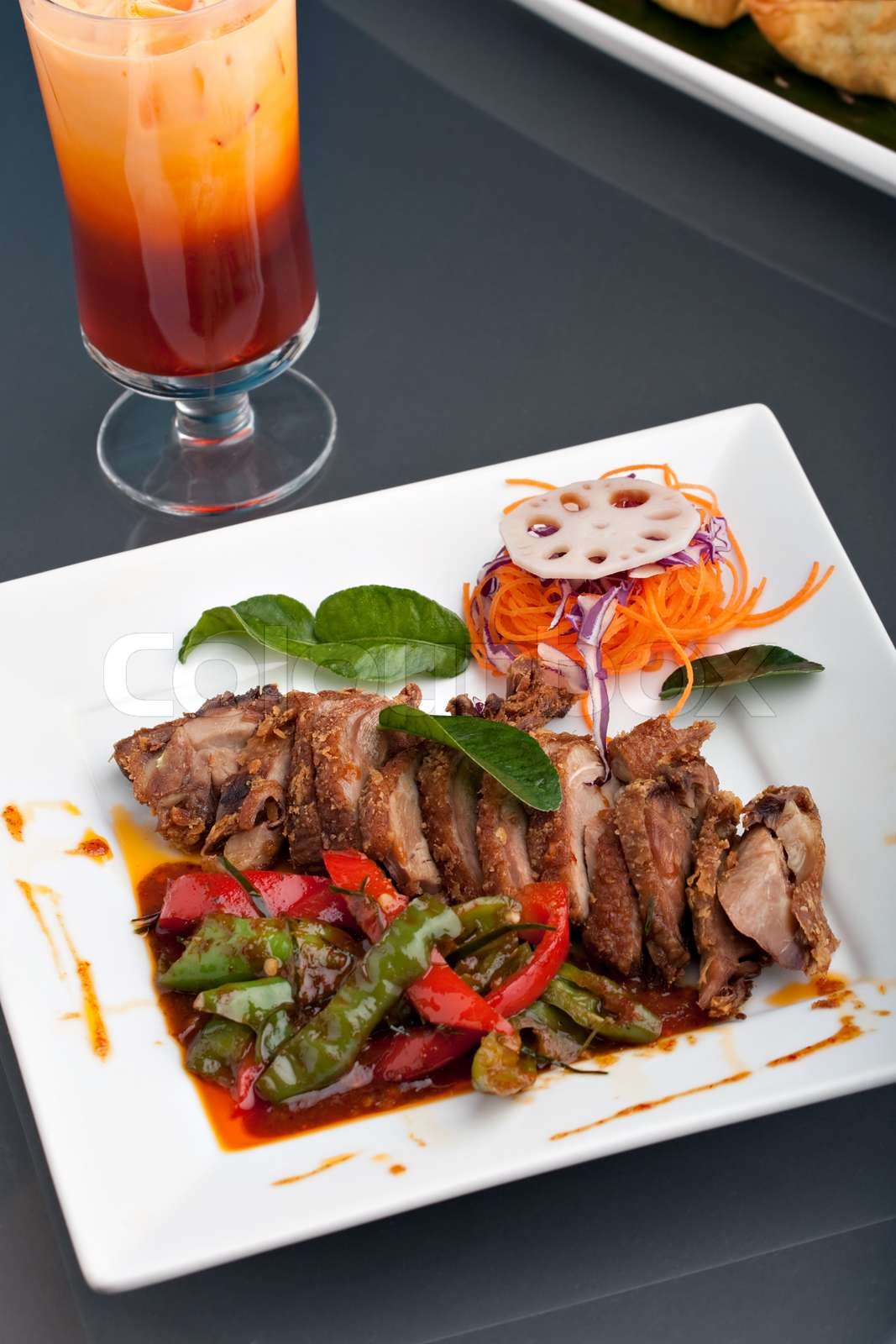 A beautifully presented dish of Thai style roast chile basil duck with