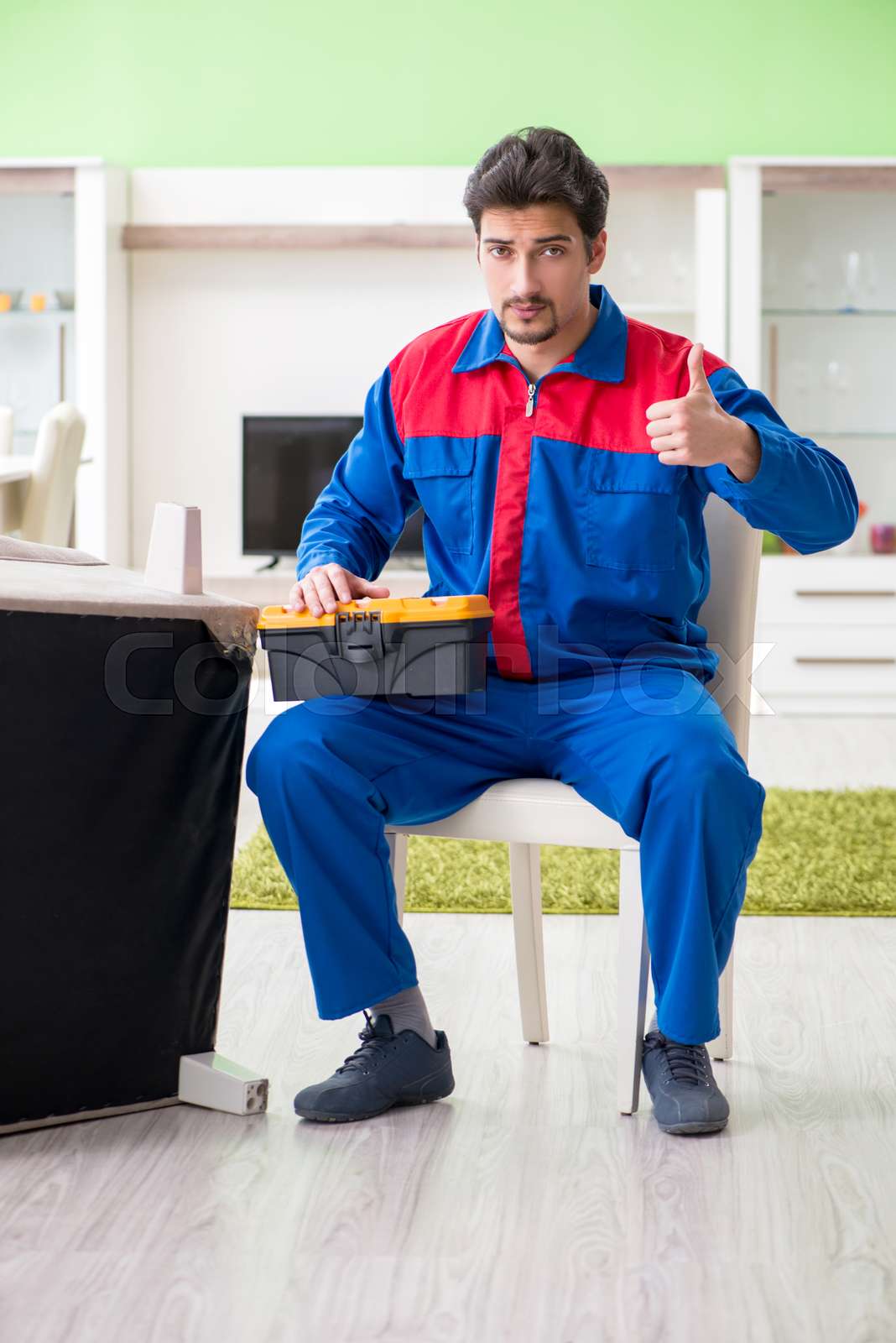 Repair Contractor Repairing Broken Furniture At Home Stock Image
