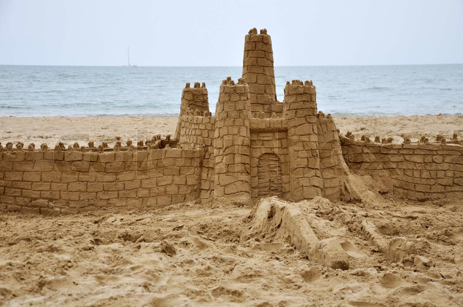 sandcastle builded in beach near the sea | Stock image | Colourbox