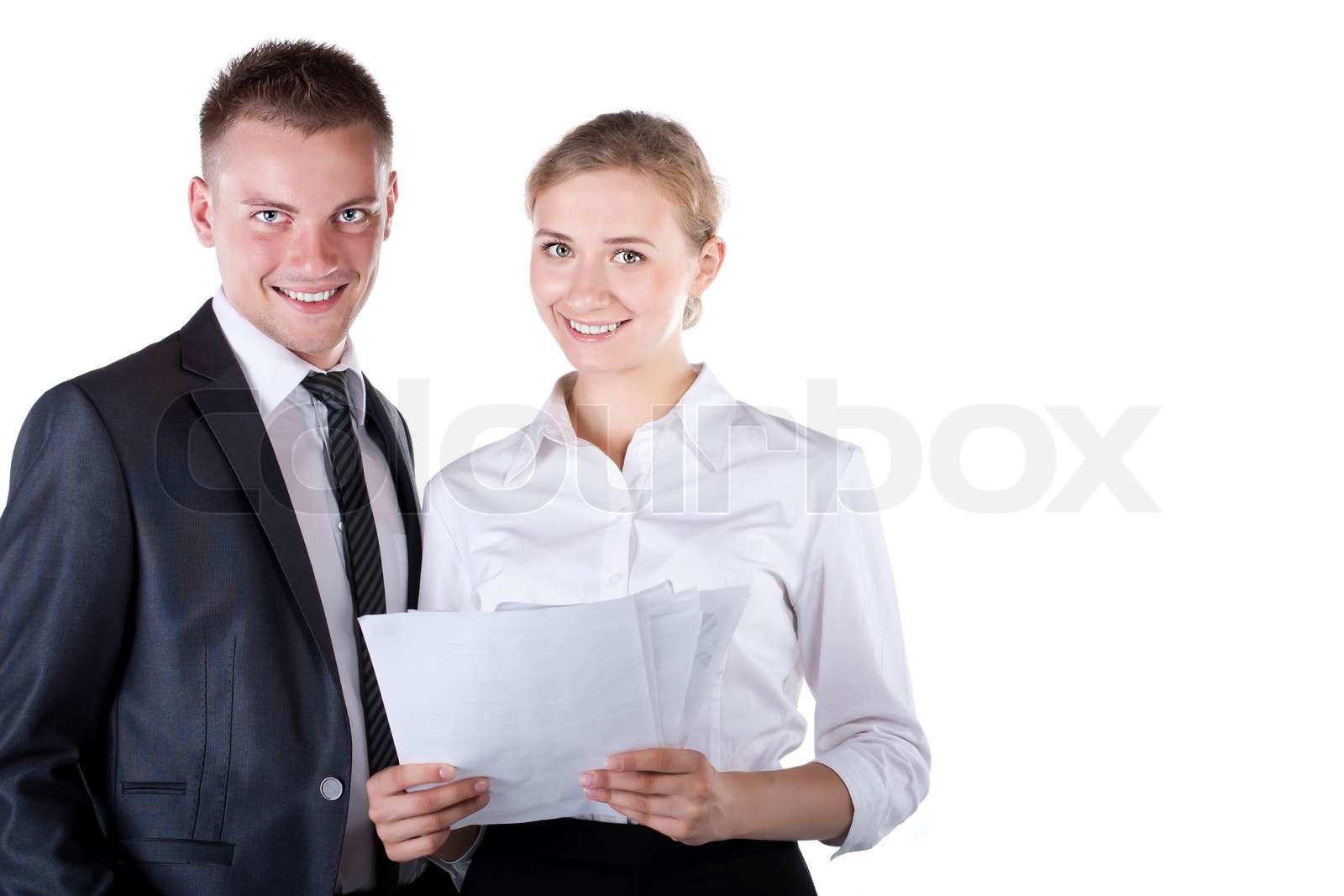 Zwei Geschäftsleute sitzen am Tisch und Schreiben | Stock Bild | Colourbox