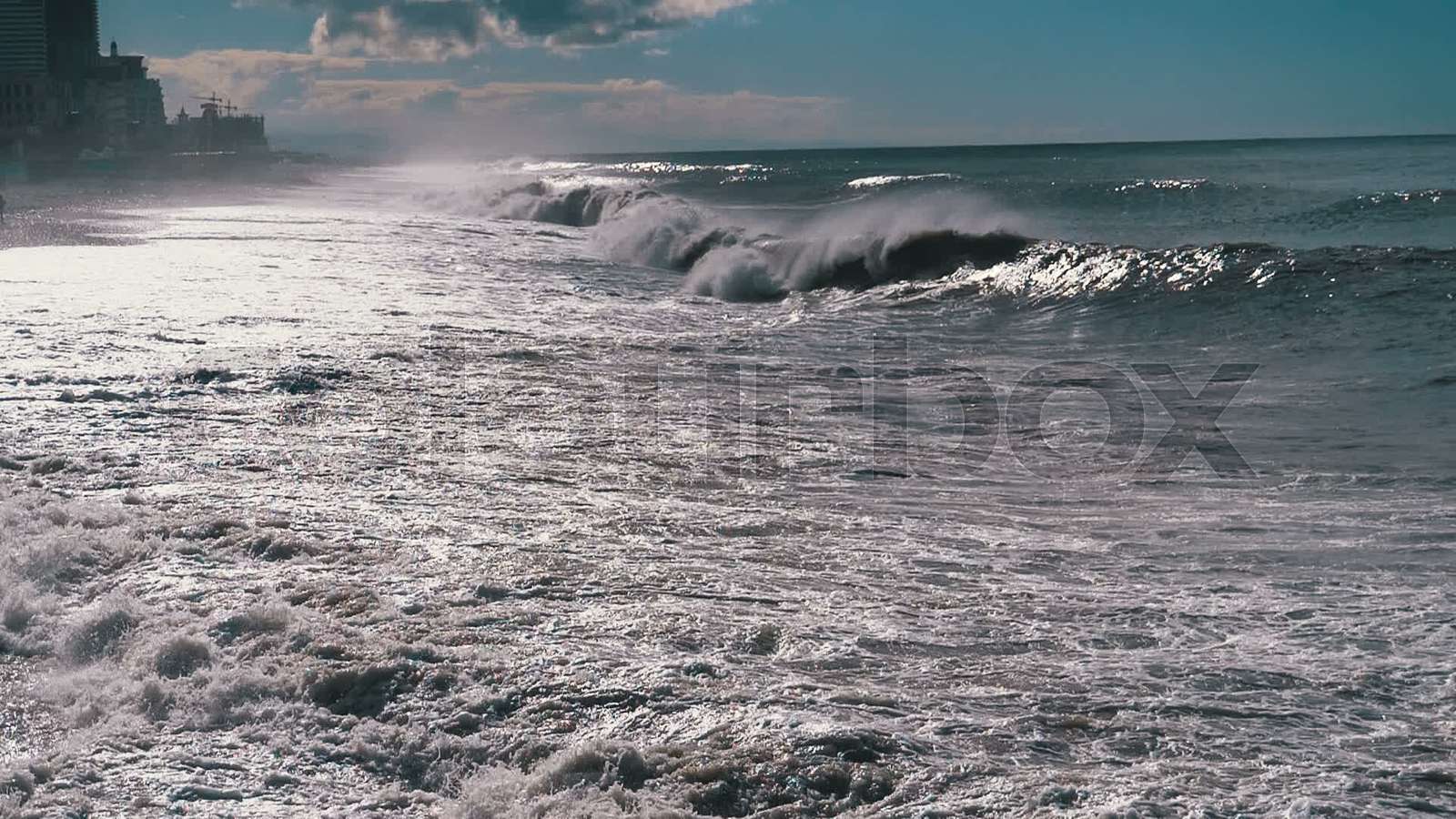 Storm on the Sea. Huge Waves are Crashing and Spraying on the Beach