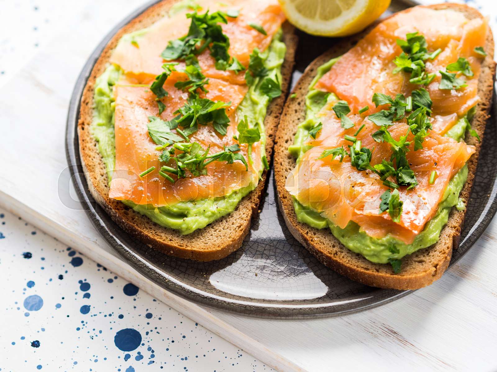 Smoked salmon and avocado toast on whole grain bread