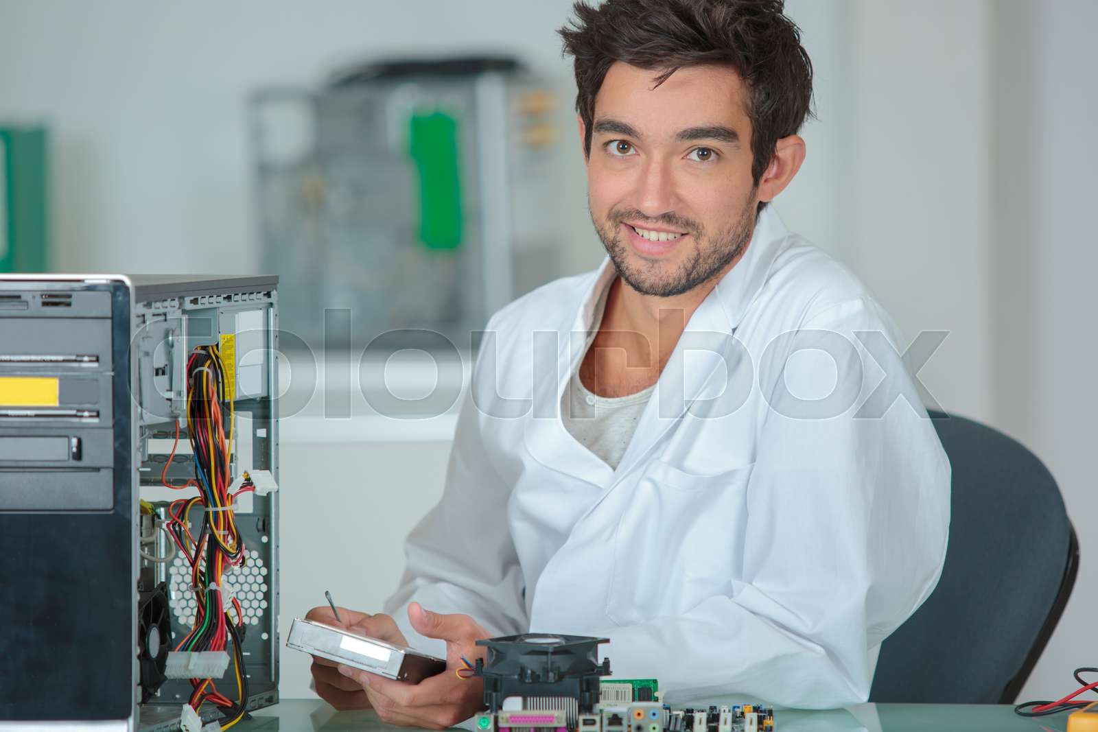 Fixing a motherboard stock image colourbox