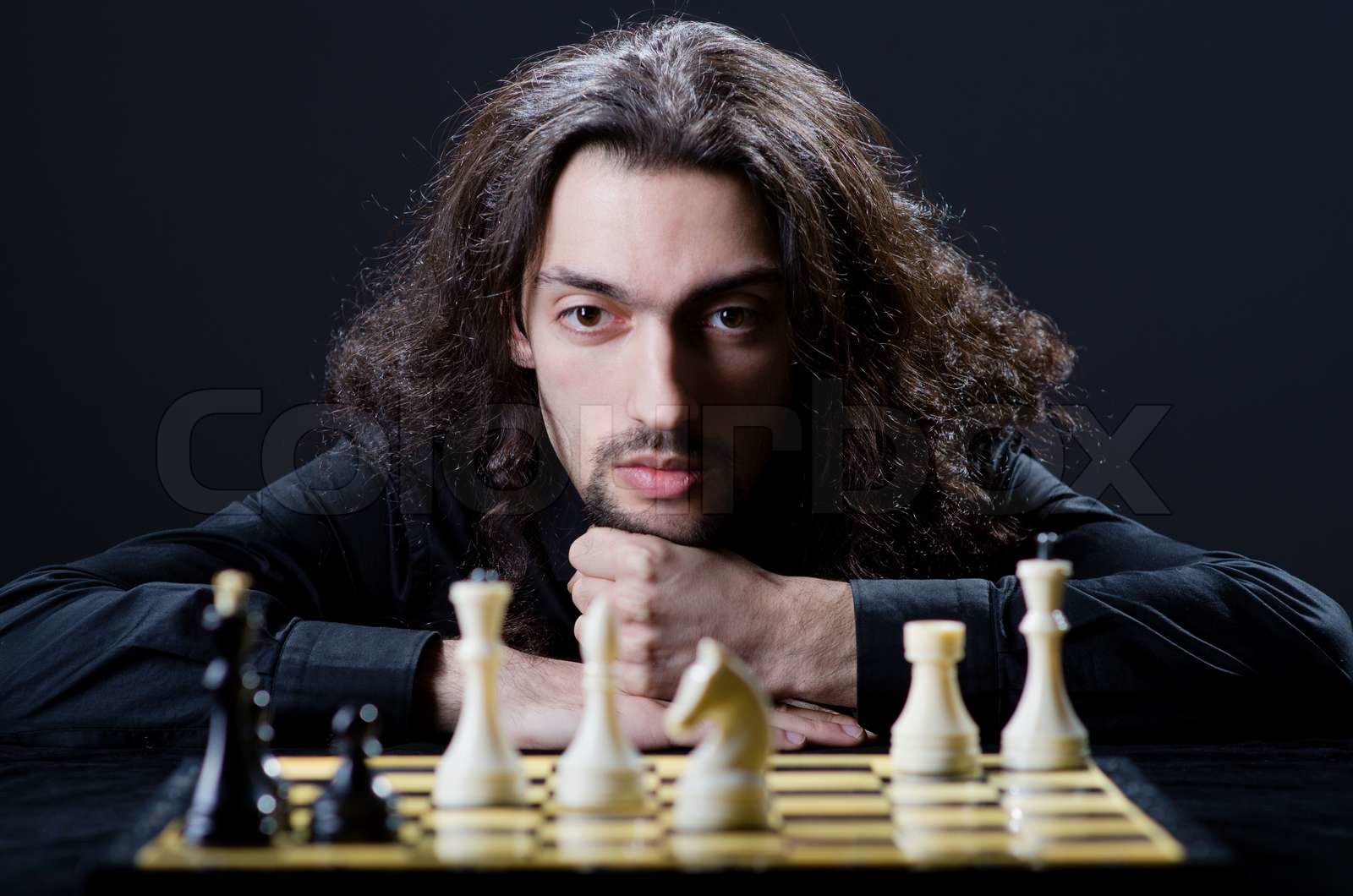 Schachspieler spielen sein Spiel Stock Bild Colourbox