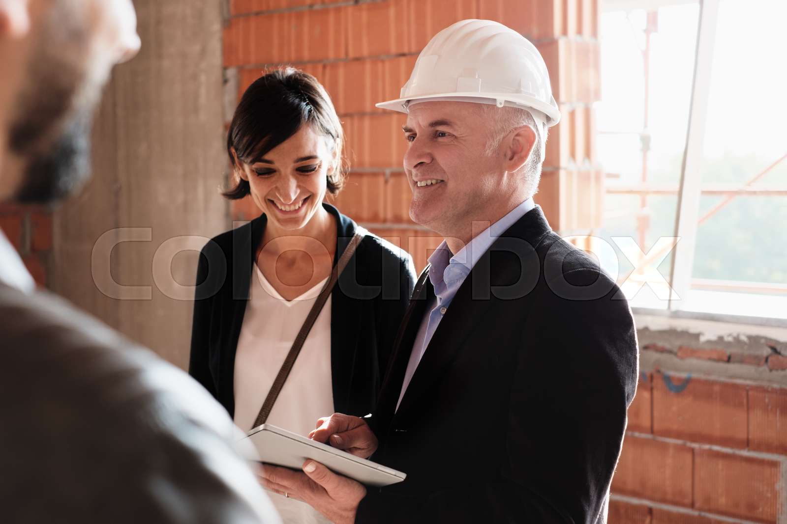 Sales Agent Showing New House To Husband And Wife | Stock image | Colourbox
