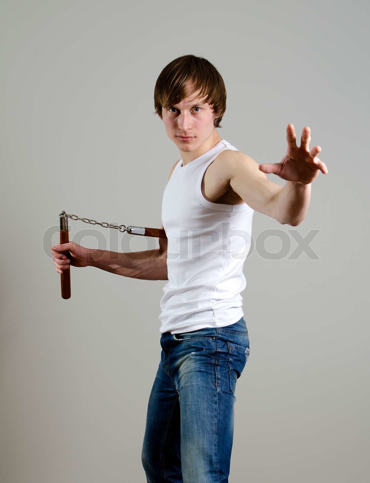 Martial Art Mann mit nunchucks Stock Bild Colourbox
