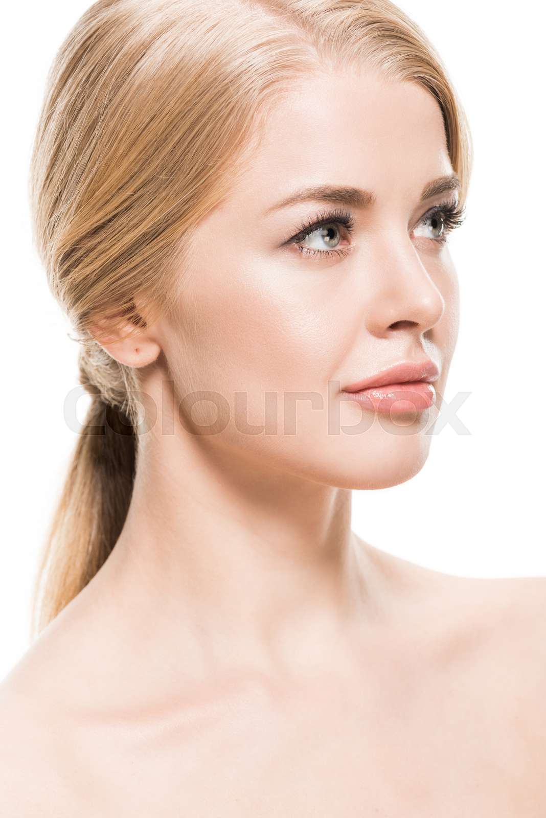 beautiful naked blonde girl with long hair looking away isolated on