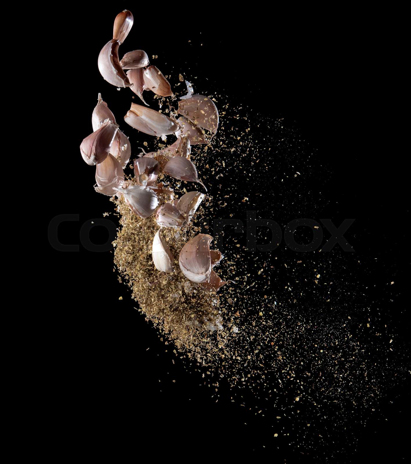 Garlic,various spices, pepper and salt splash or explosion flying in