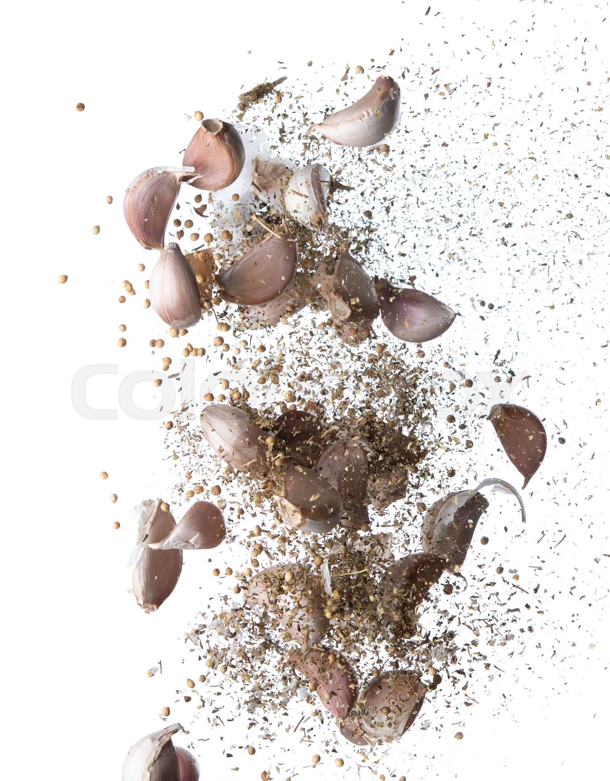 Garlic,various spices, pepper and salt splash or explosion flying in