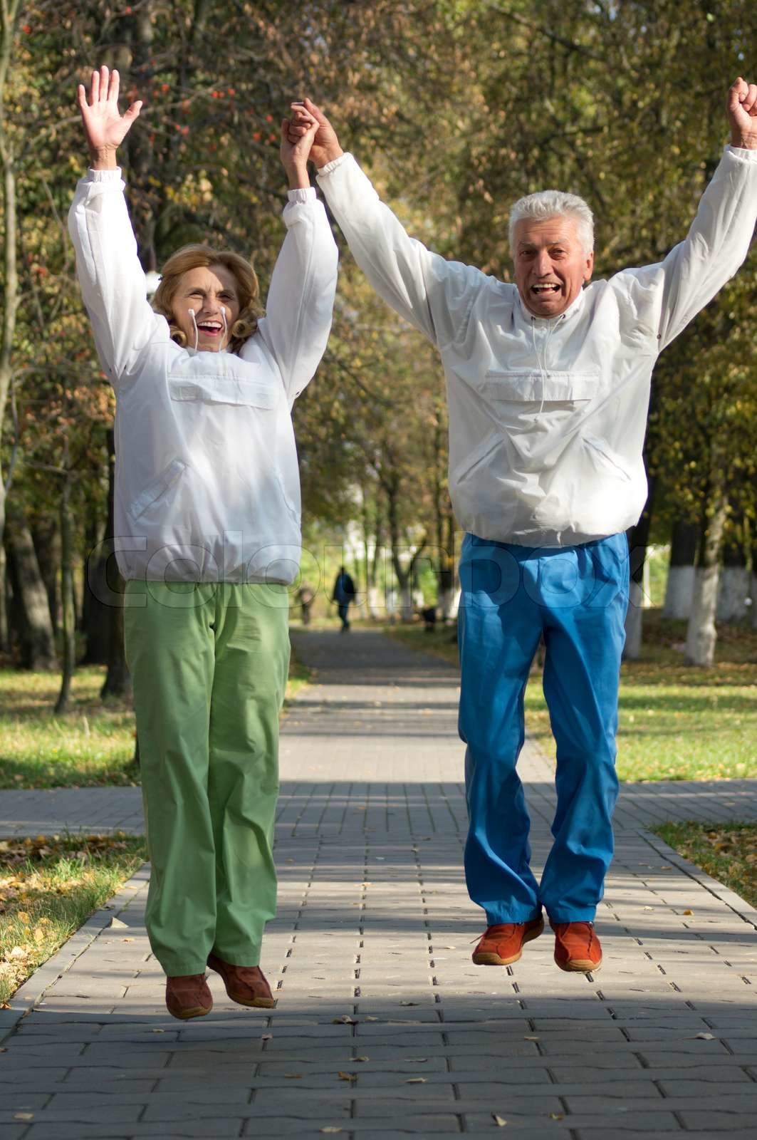 active old people jump in park | Stock image | Colourbox