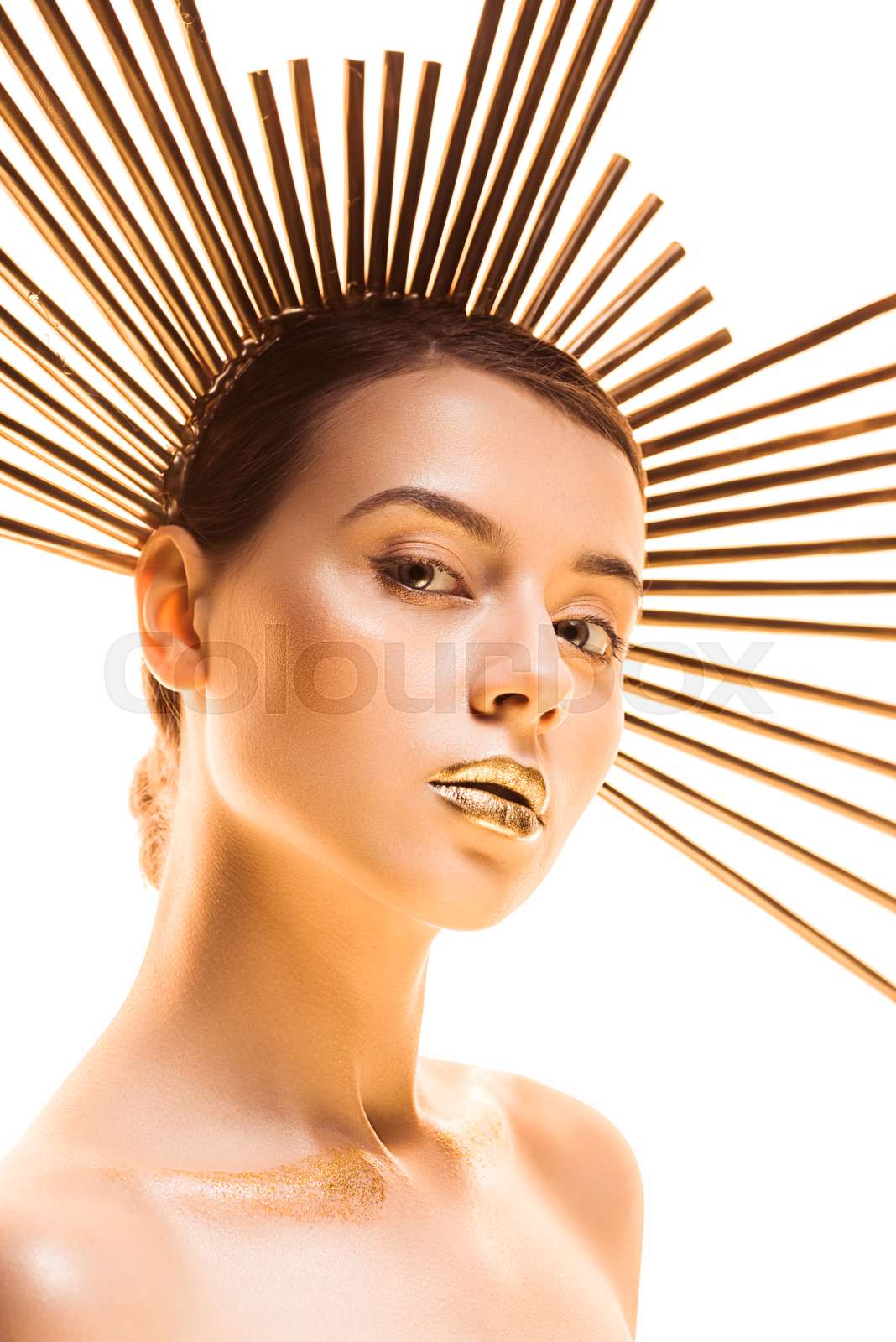 young nude beautiful woman with golden makeup and accessory on head