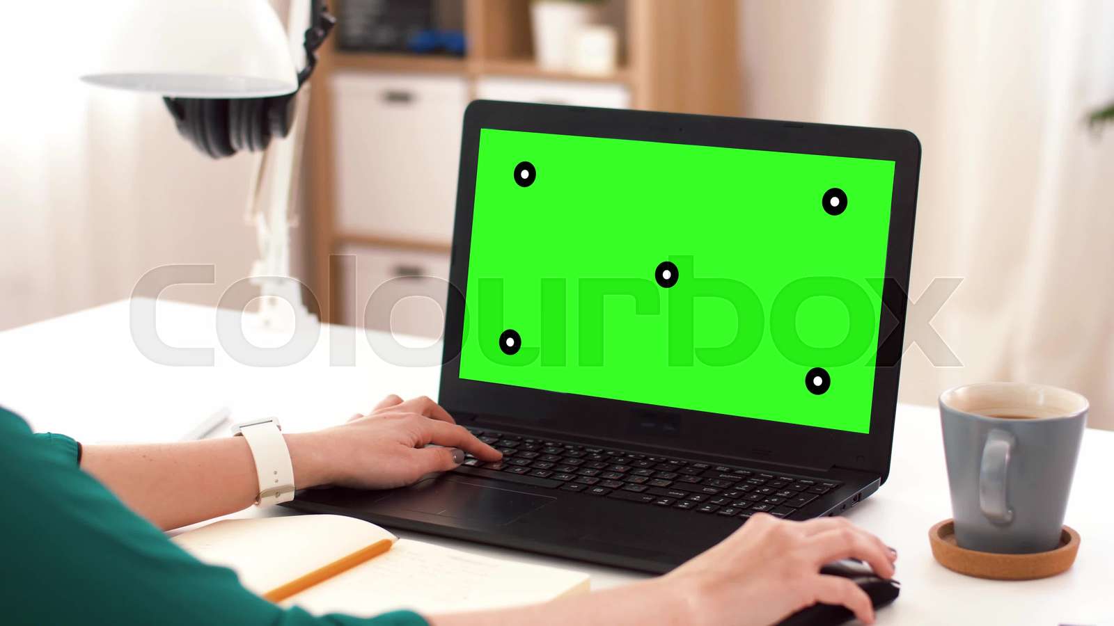 woman with green screen on laptop at home Stock video Colourbox