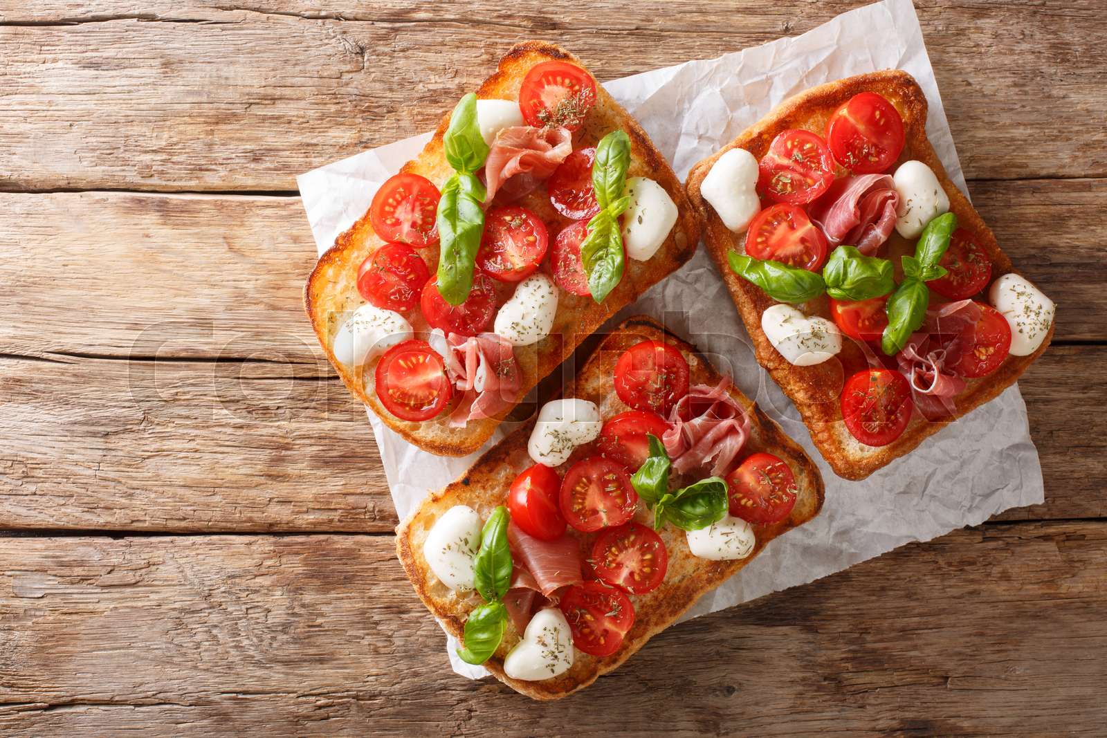 Delicious ciabatta with mozzarella, tomatoes, prosciutto and basil