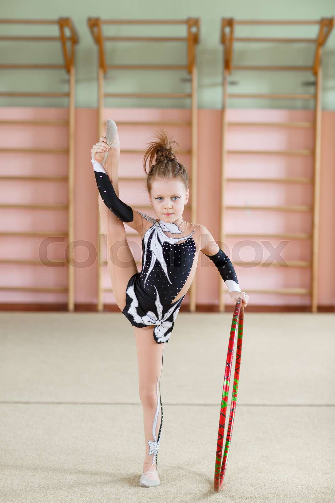 Young girl doing gymnastics in the gym. | Stock image | Colourbox