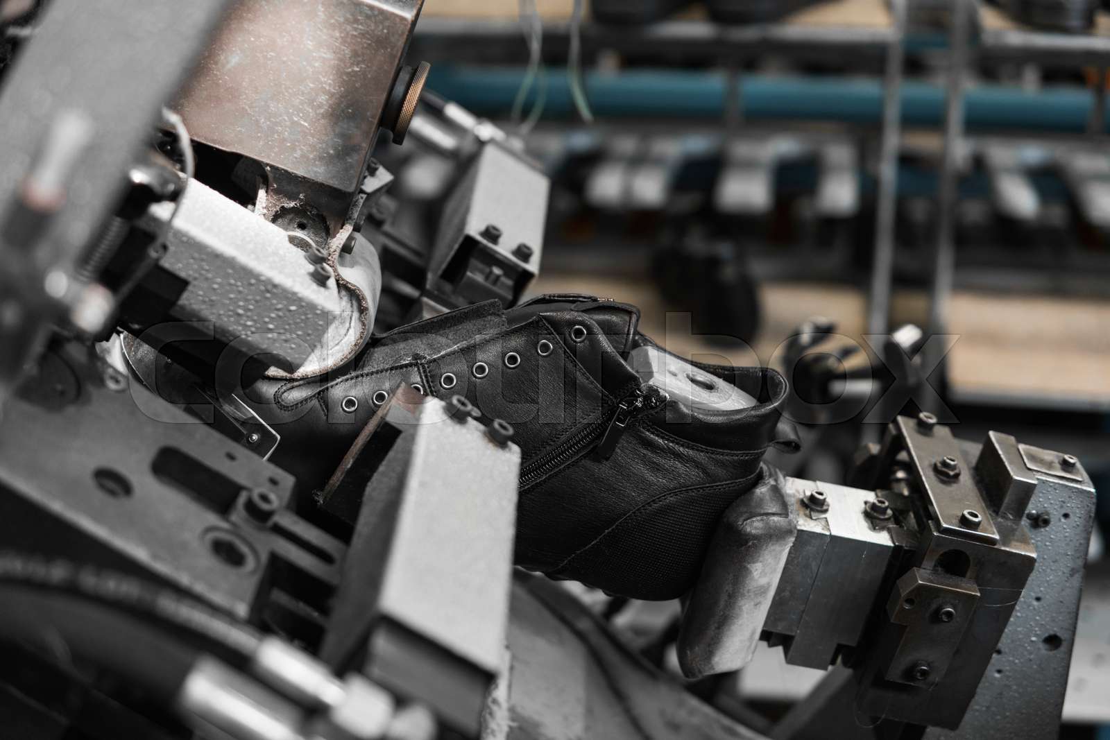 Man use special machine tool for making a shoes. The conveyor on a