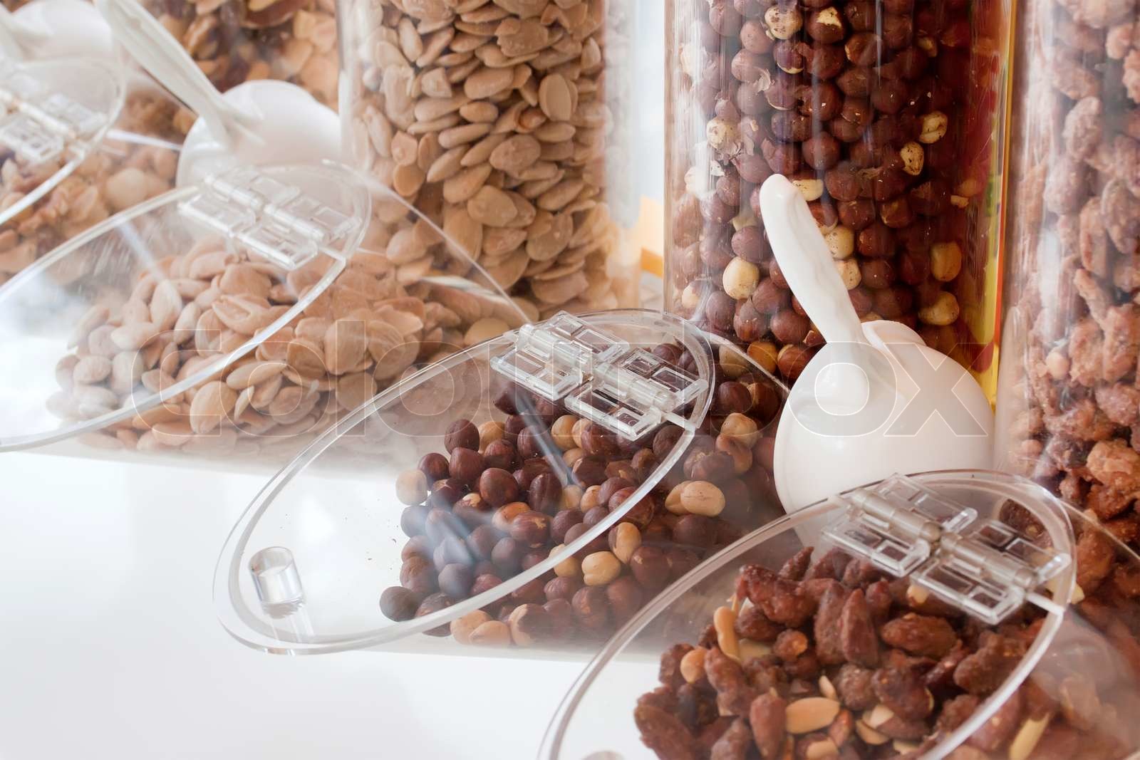 Nuts Mixed in glass containers Stock image Colourbox