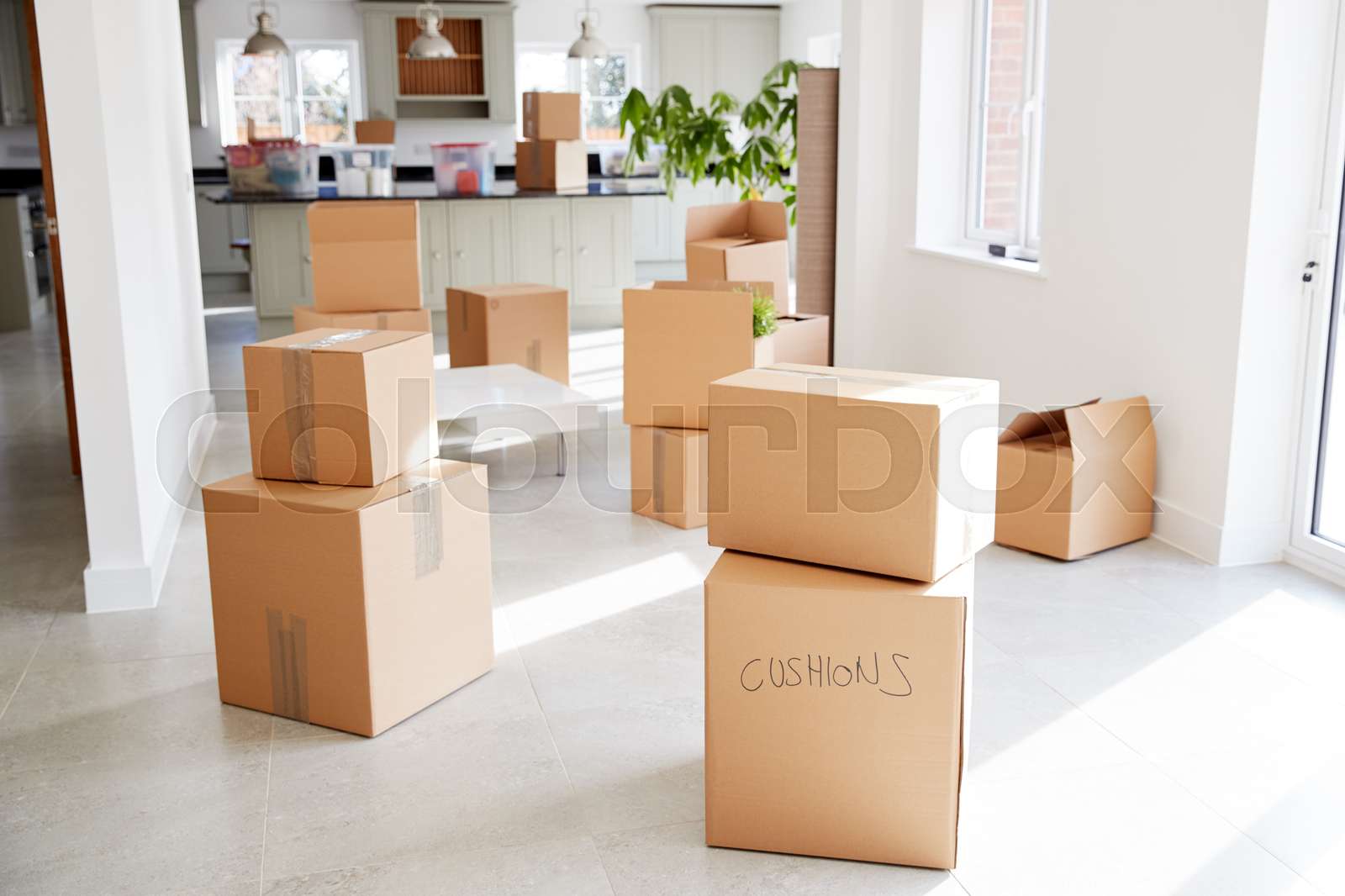 Stacked Removal Boxes In Empty Room On Moving Day | Stock image | Colourbox