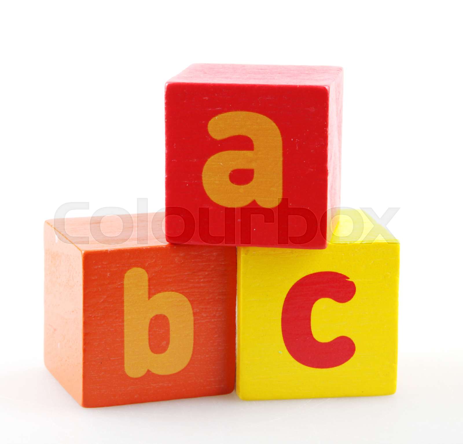 Wooden alphabet blocks against white background stock image colourbox