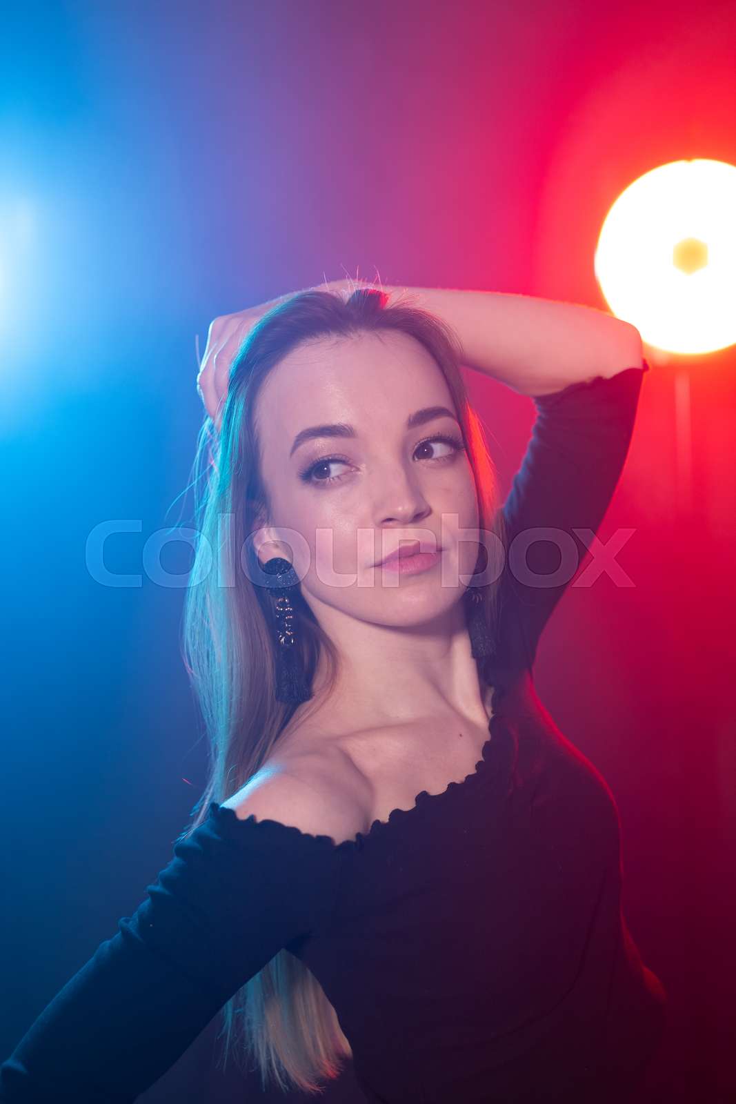 nightlife-and-club-concept-young-woman-dancing-in-the-dark-under-the