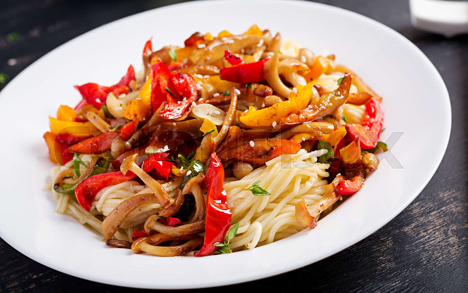 Noodles with shimeji mushrooms and paprika. Oriental meal. Japanese