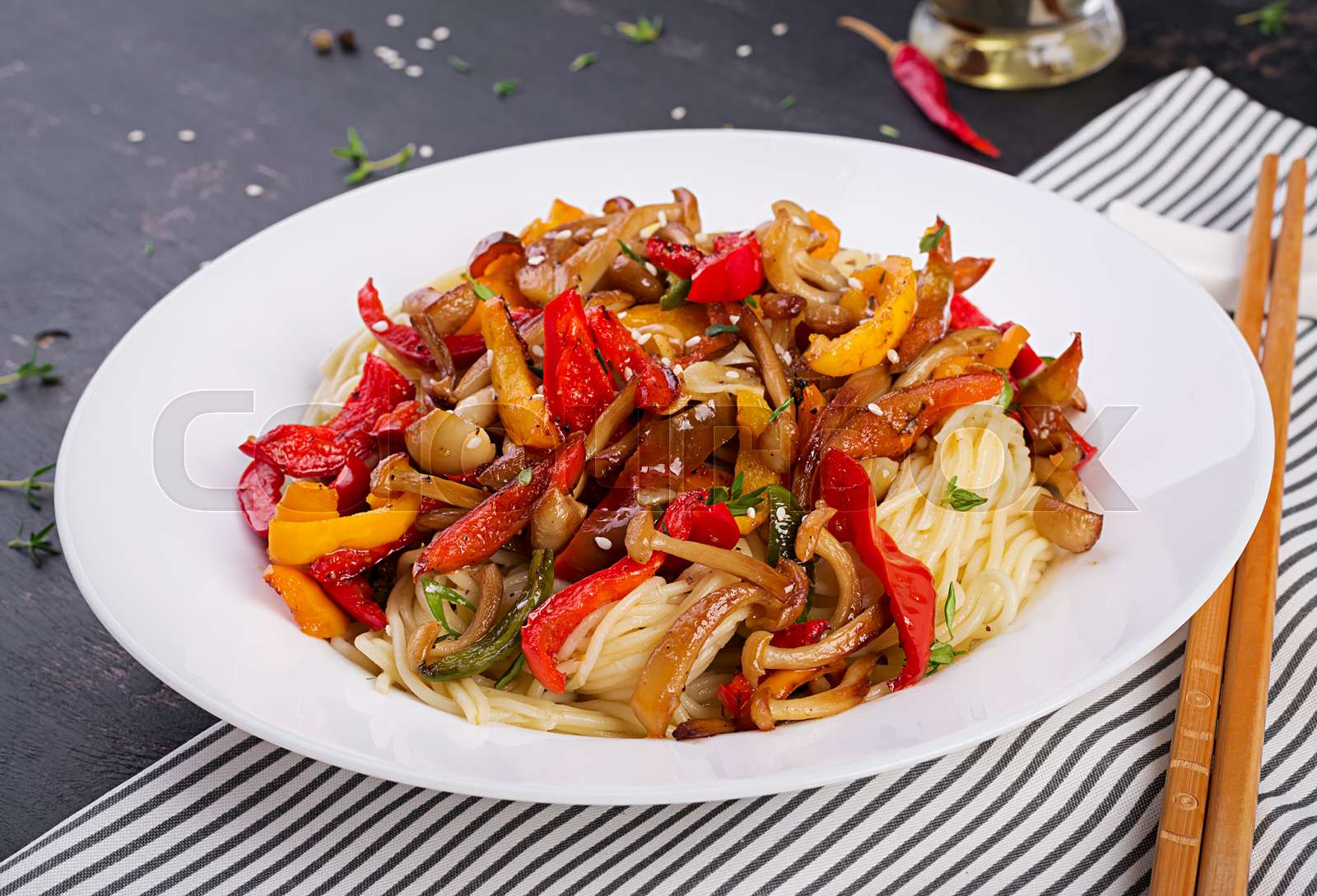 Noodles with shimeji mushrooms and paprika. Oriental meal. Japanese