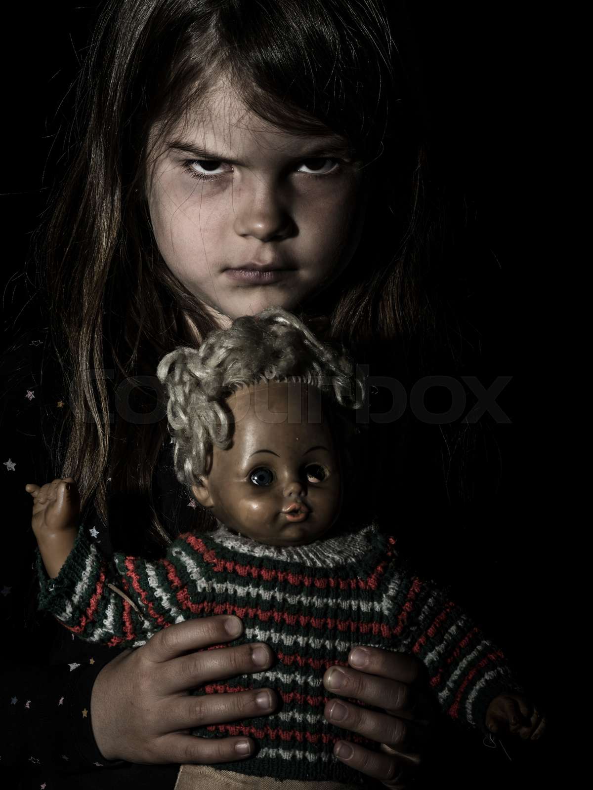 Creepy Young Girl With Scary Doll Stock Image Colourbox