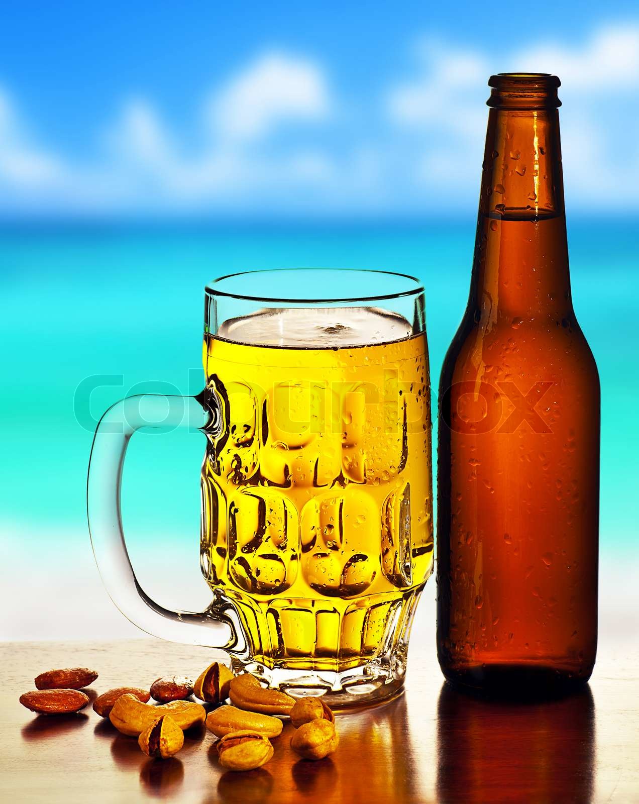 Cold beer on the beach Stock image Colourbox