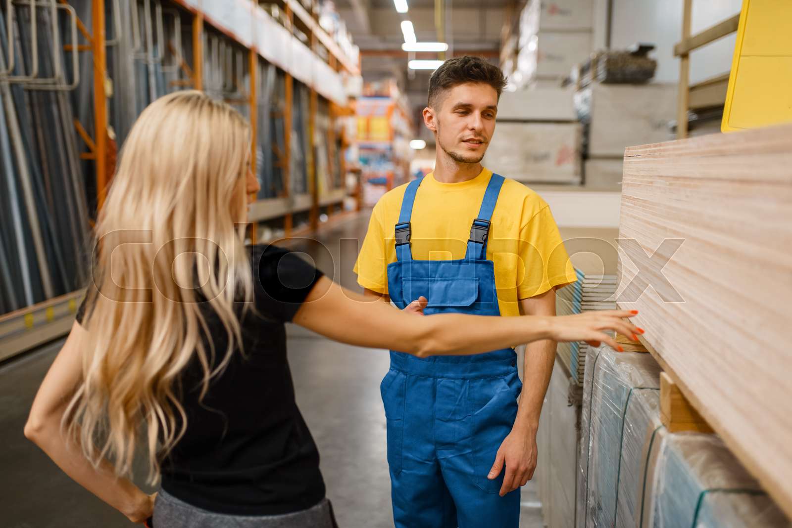 Consultant and female customer in hardware store Stock image Colourbox