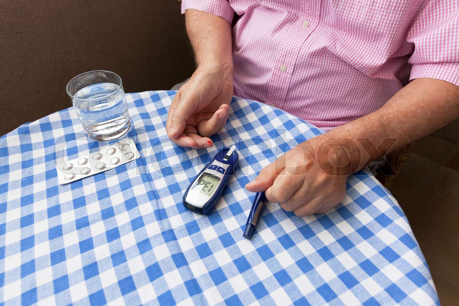 Man Using Glucometer Senior man using glucometer checking blood sugar. Healthcare and ...