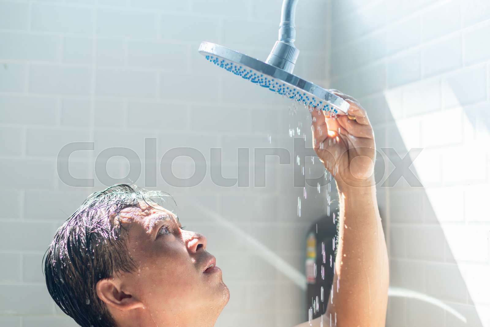 Worried Asian man take a shower in the bathroom and water was turned