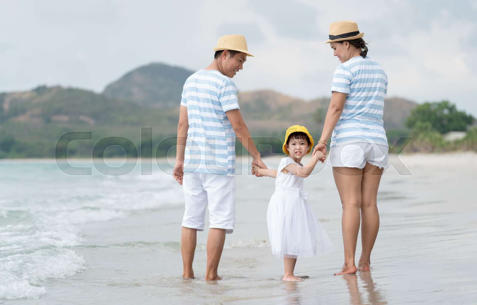 Happy asian family on the beach. | Stock image | Colourbox