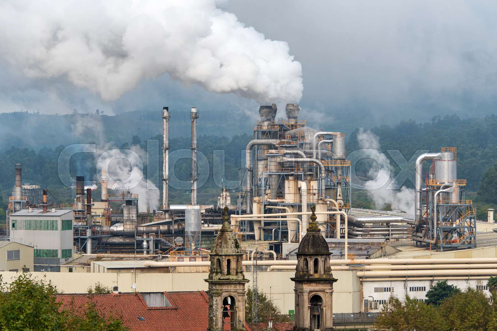 Chemical factory with smoke stack. Smoke emission from factory pipes. Ecology and environmental protection problems, air pollution