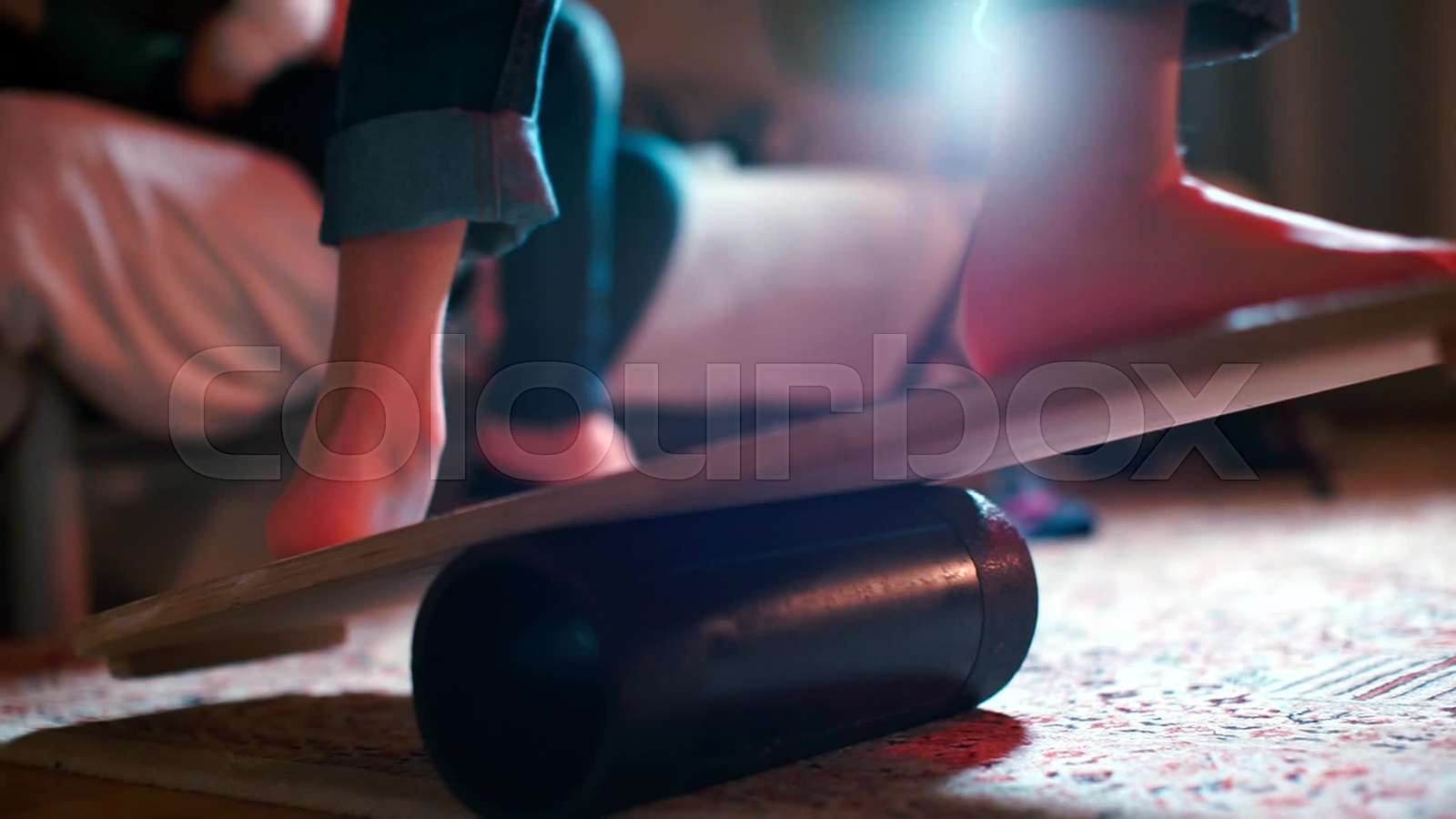 The legs are balanced on the balance board. Training the muscles of the legs. Stock video