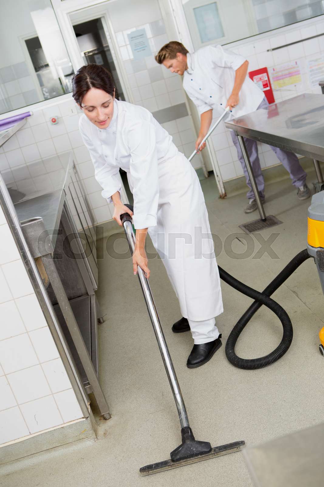 professional cleaning service in uniforms at work | Stock image | Colourbox