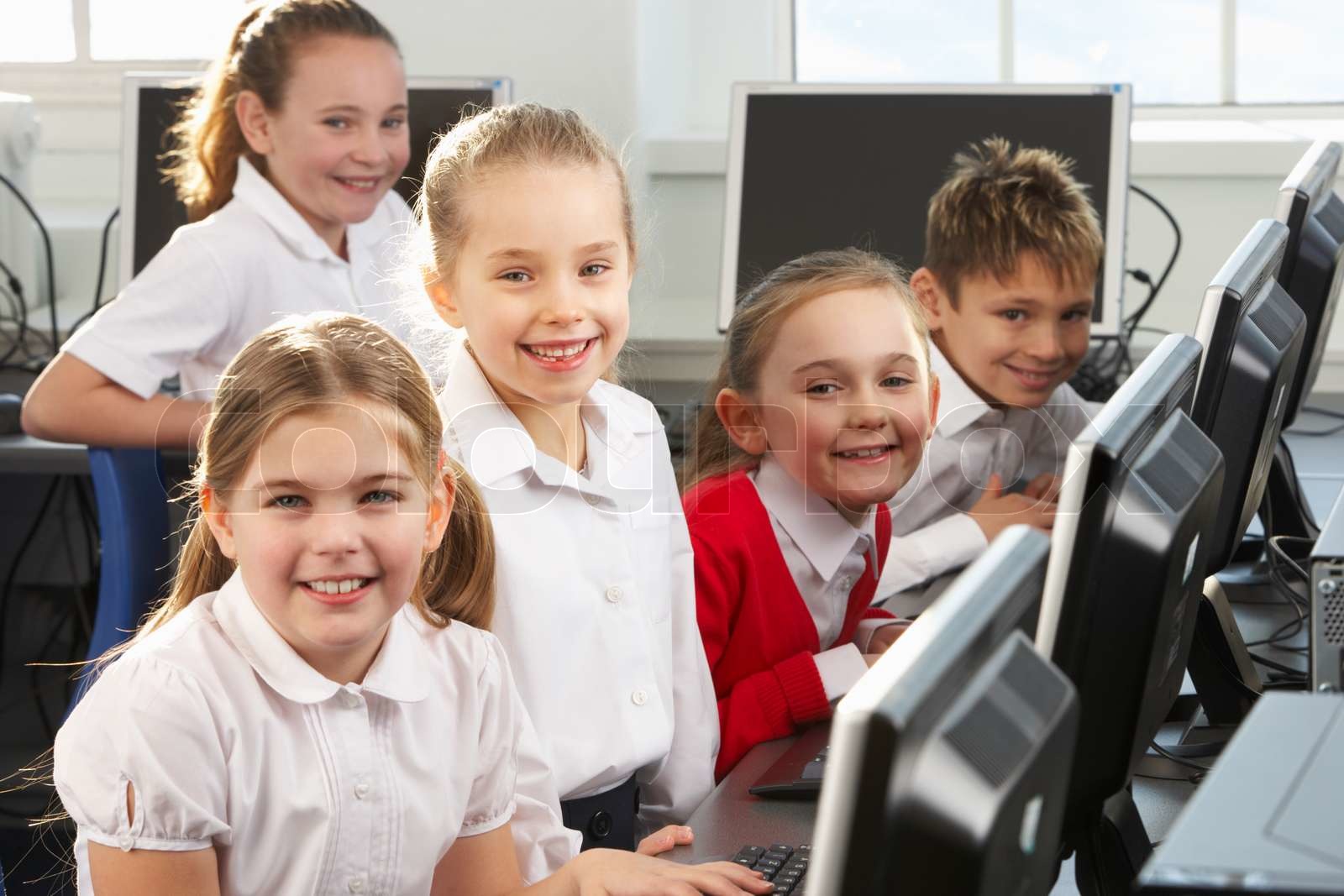 Children using computers in school class | Stock image | Colourbox