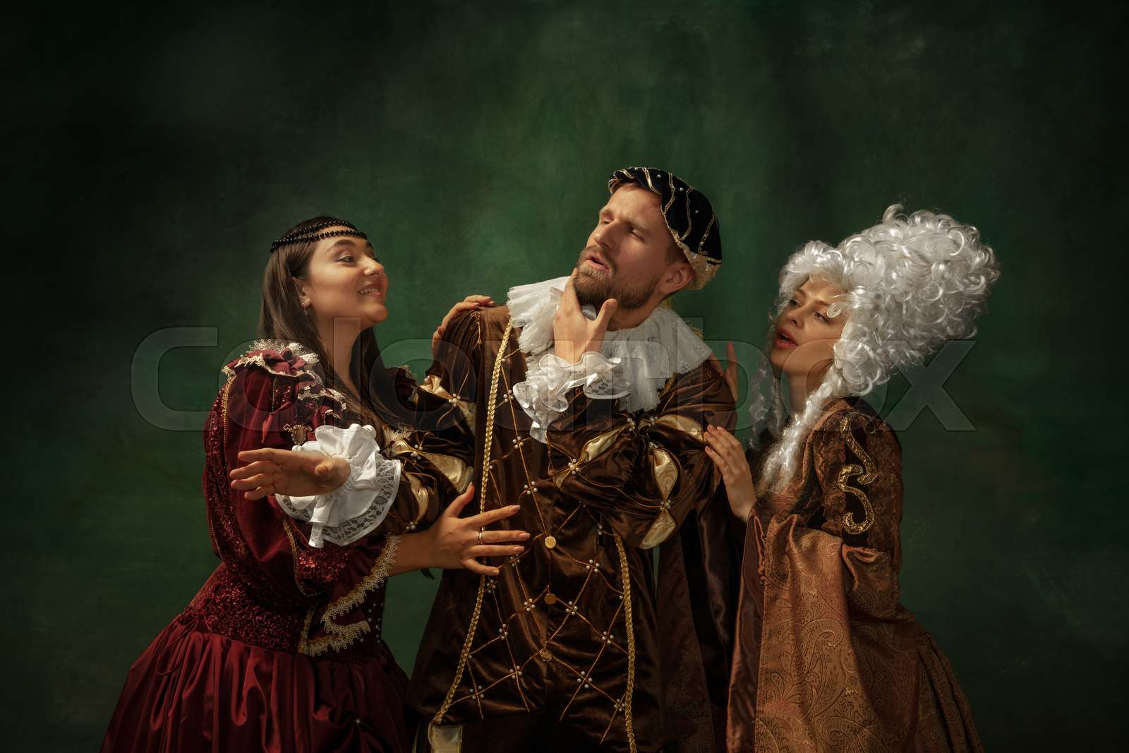 Medieval young man and women in old-fashioned costume | Stock image ...