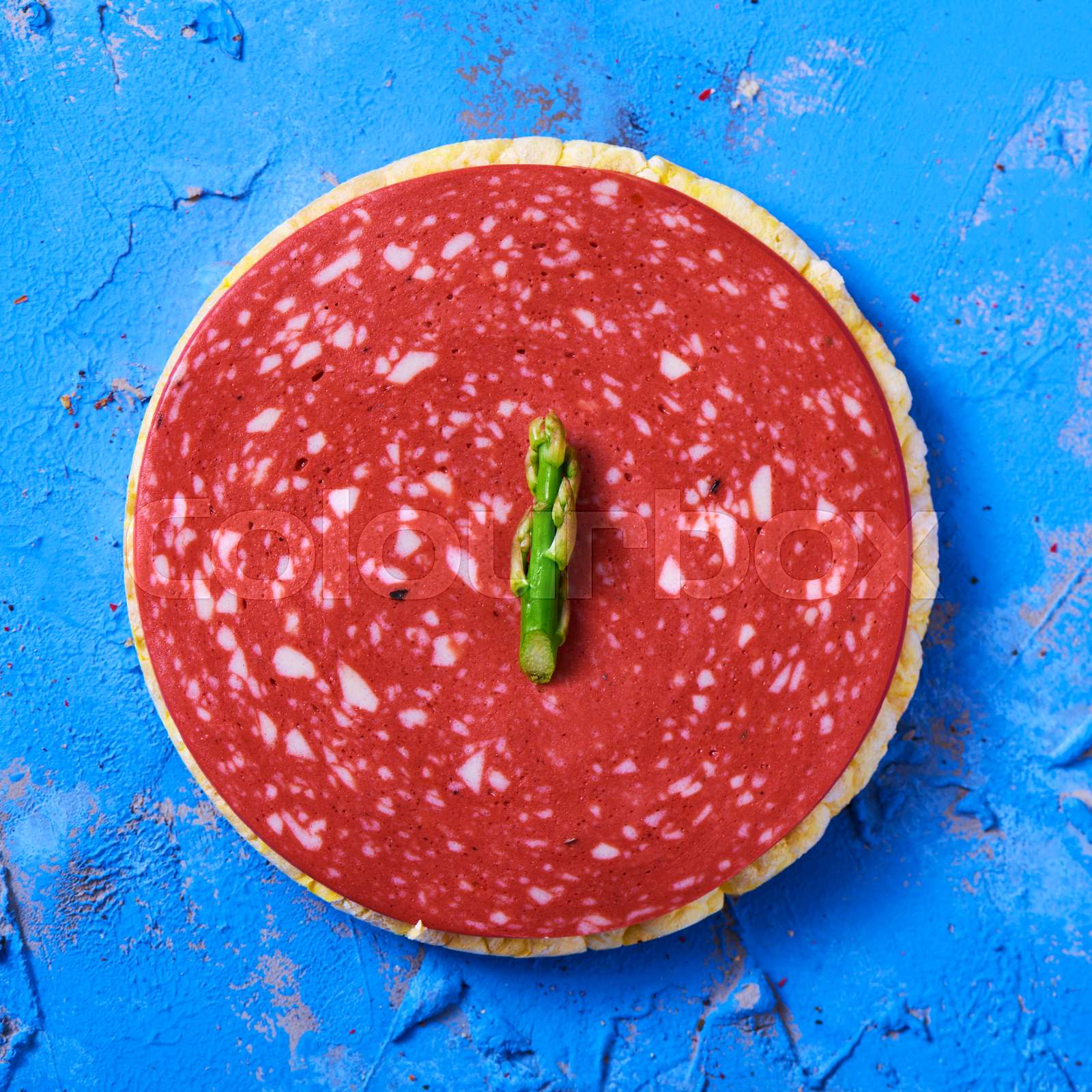 slice of veggie salami on a rice cake Stock image Colourbox